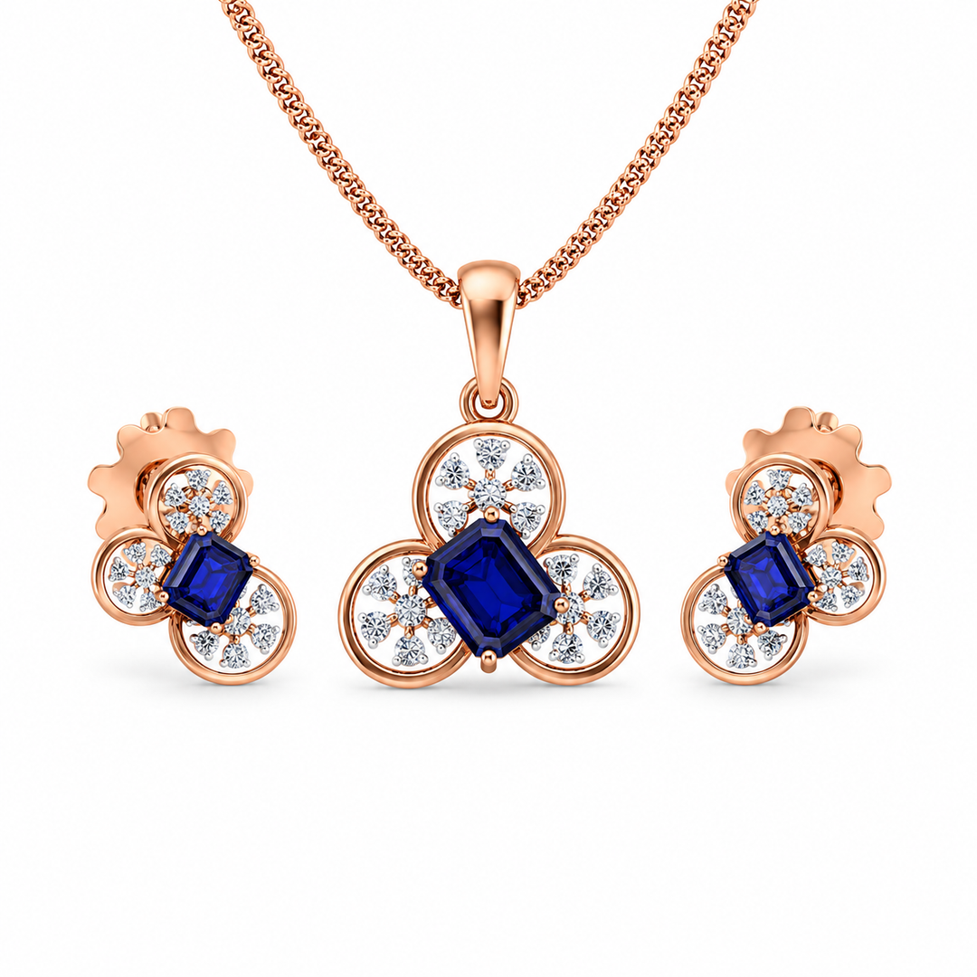 Rose gold jewelry set with blue gemstones on a white background