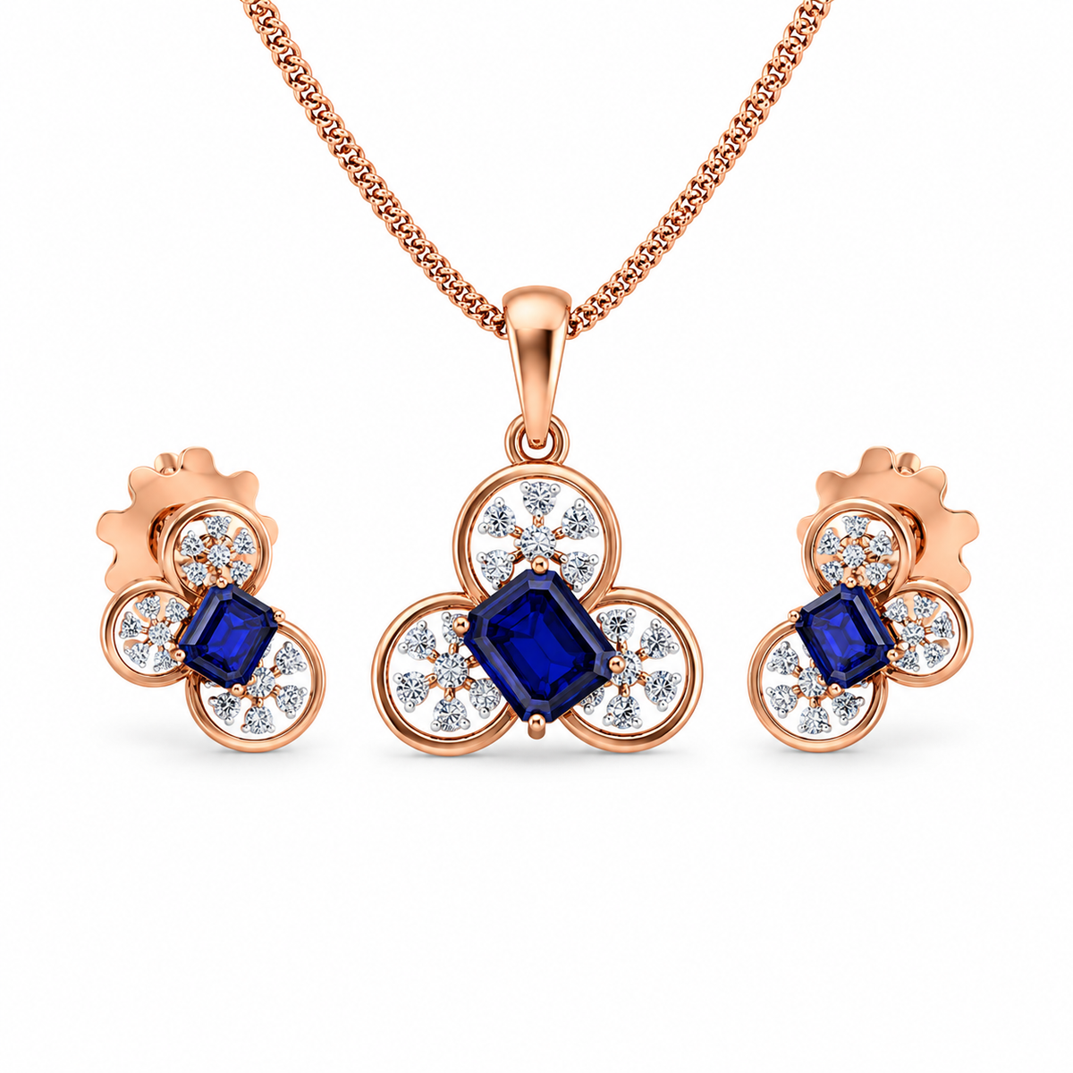 Rose gold jewelry set with blue gemstones on a white background