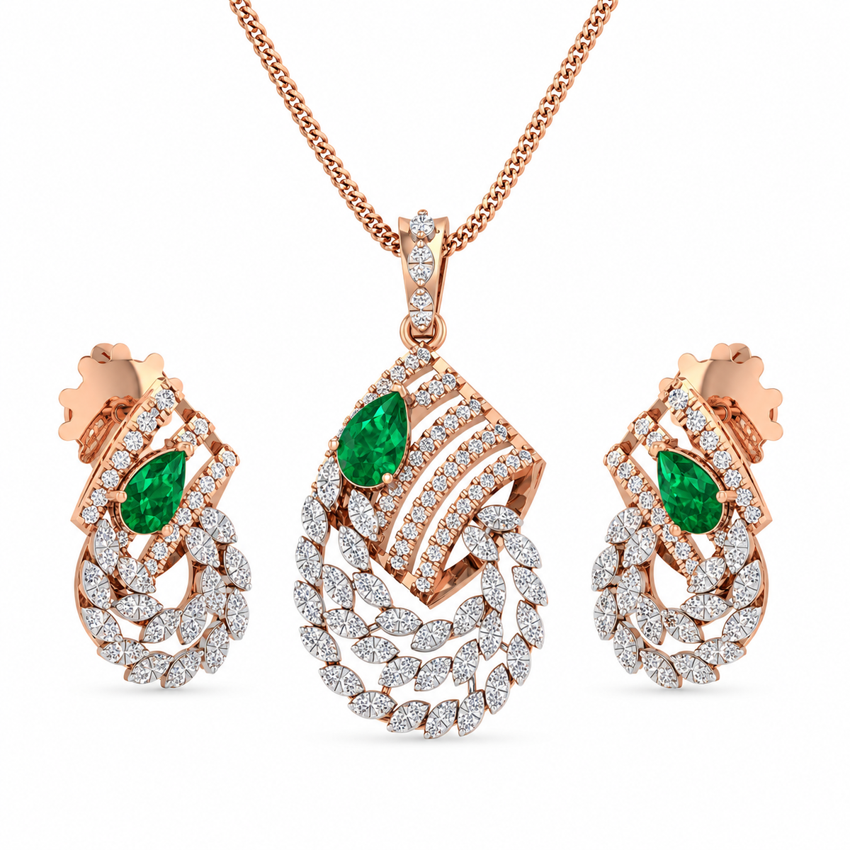 Rose gold jewelry set with emerald green stones on a white background