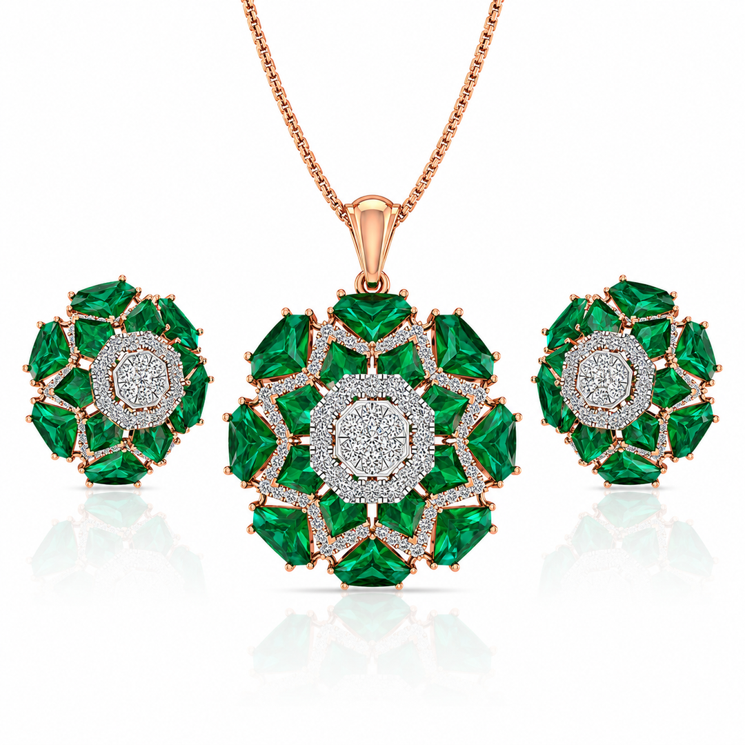 Jewelry set with emerald green gemstones and rose gold accents on a white background