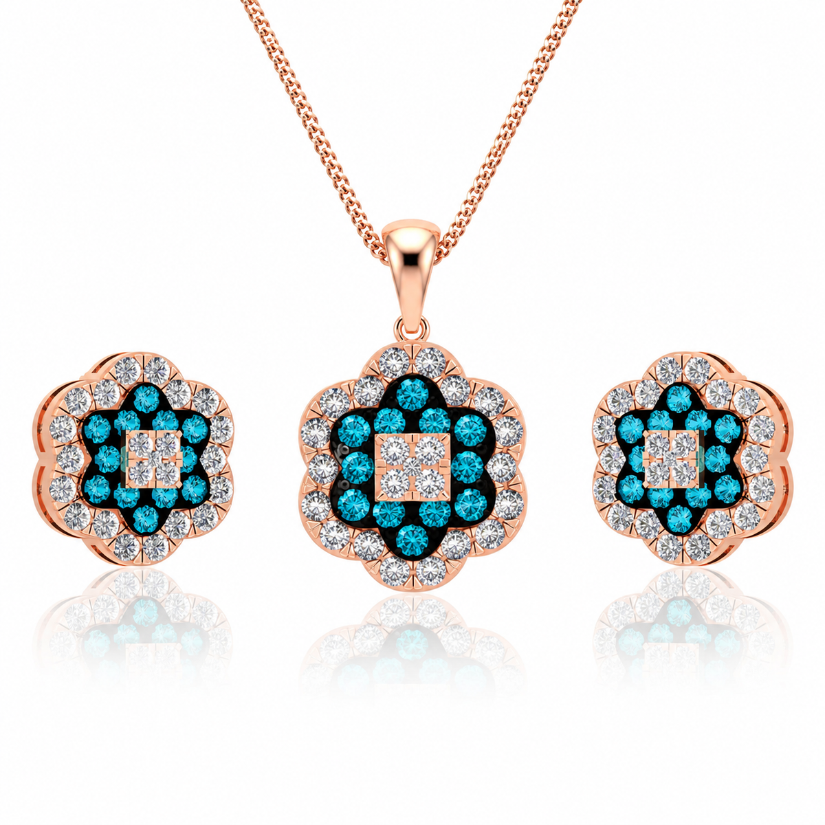 Jewelry set with rose gold pendant and earrings featuring blue gemstones on a white background