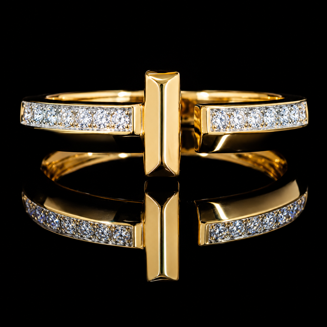 A gold ring with a central rectangular bar and two curved bands paved with clear stones, shown on a glossy black reflective surface.
