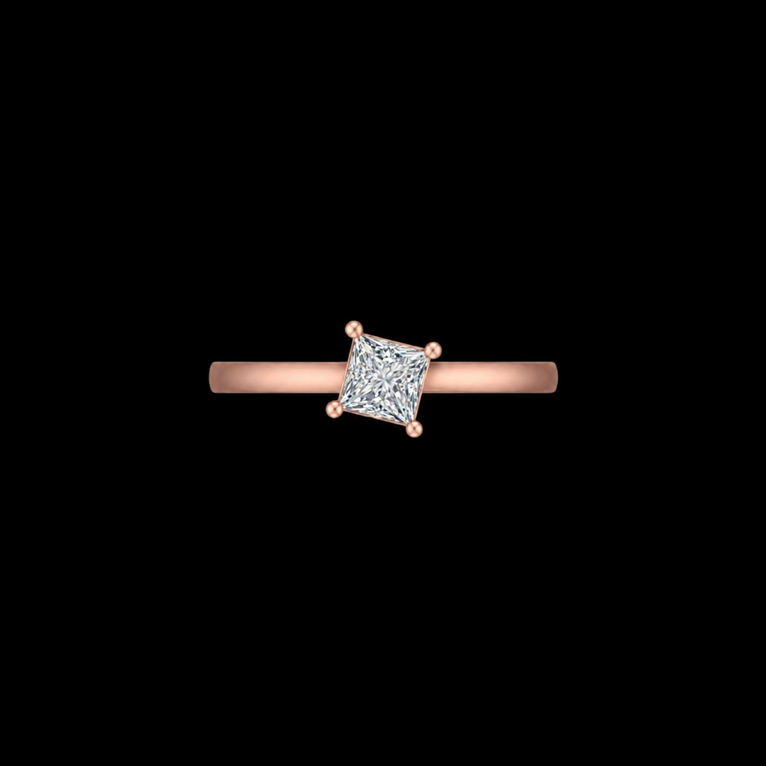 Rose gold ring with a diamond on a black background