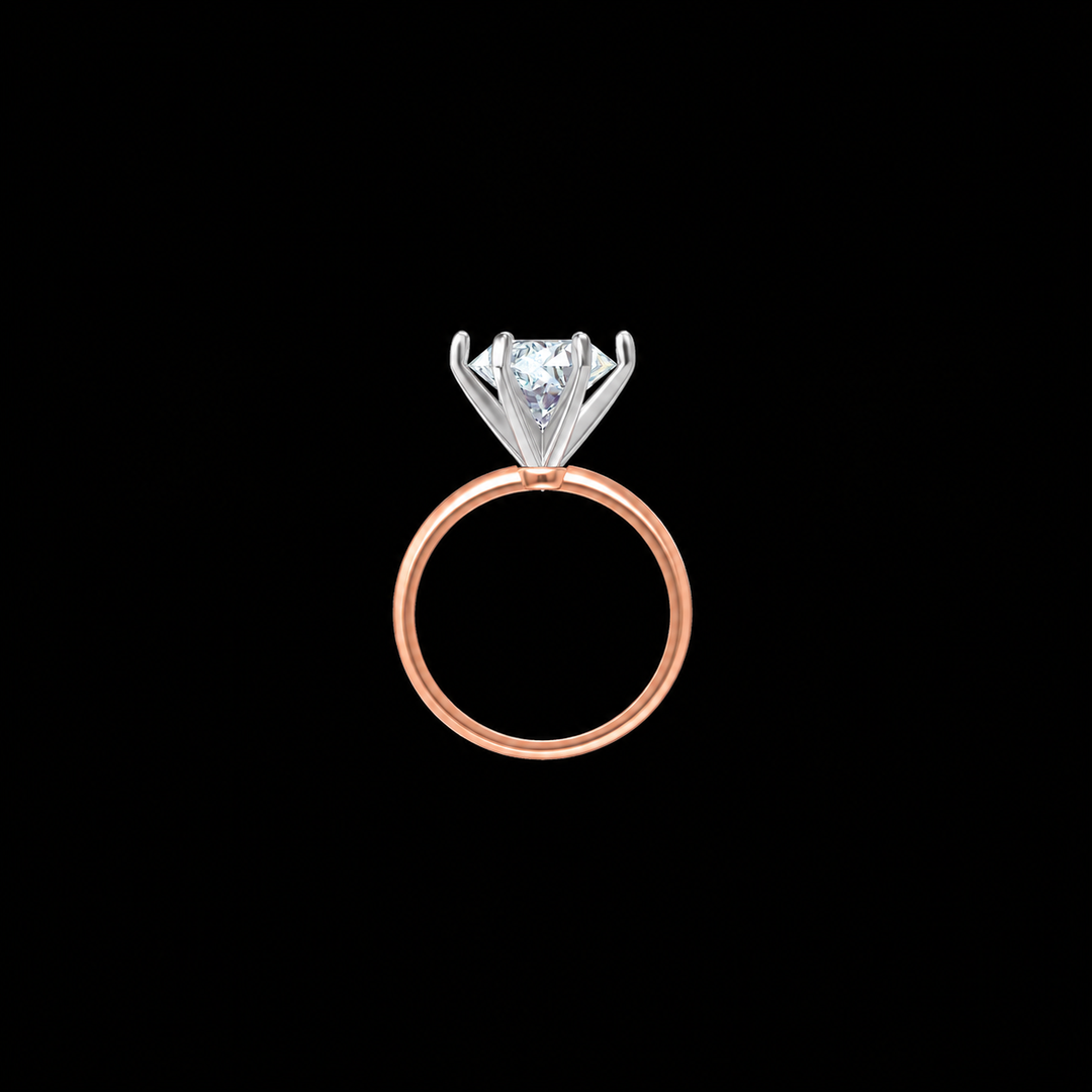 Rose gold ring with a diamond on a black background